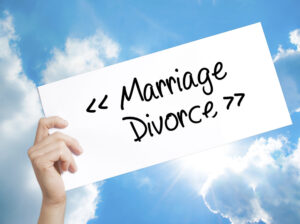Marriage - divorce sign on white paper. Marriage is hard work. Divorce is hard work. 