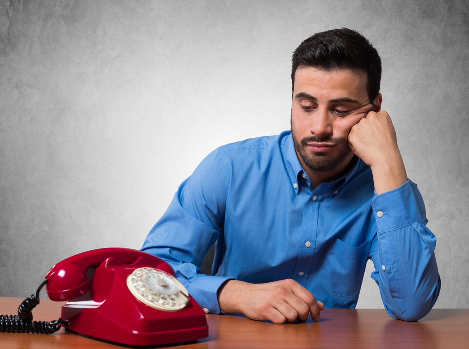 Man waiting by the phone